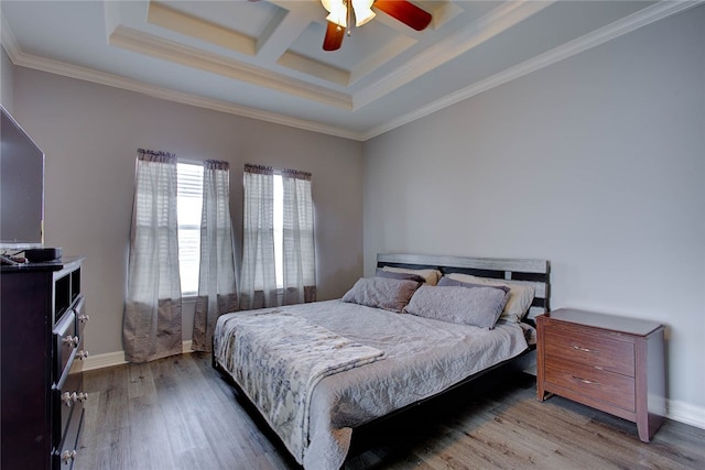 bedroom with ceiling fan, wood-type flooring, crown molding, and coffered ceiling