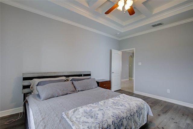 bedroom featuring hardwood / wood-style flooring, ceiling fan, crown molding, and coffered ceiling