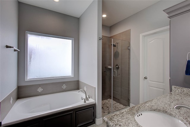 bathroom featuring vanity and plus walk in shower