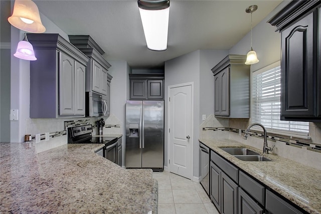 kitchen with stainless steel appliances, sink, and gray cabinetry