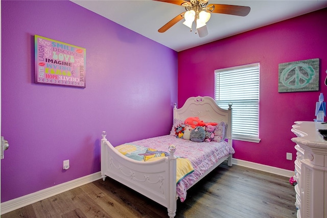 bedroom with dark wood-type flooring and ceiling fan