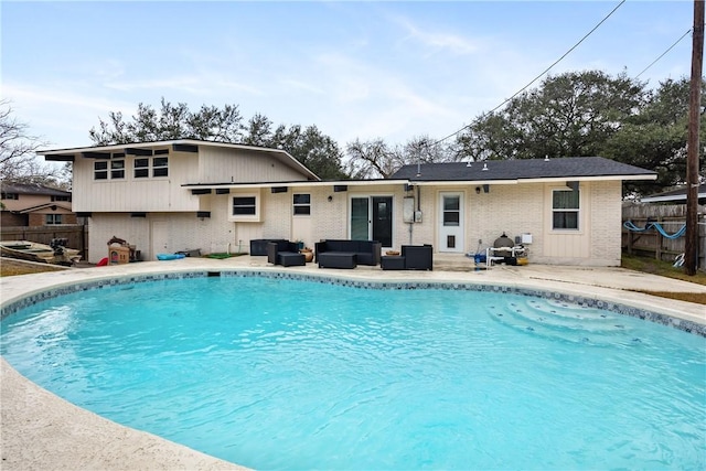 view of swimming pool with outdoor lounge area and a patio