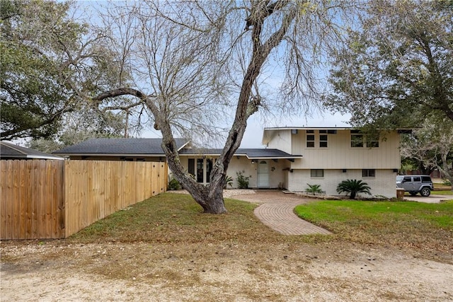 split level home with a front yard