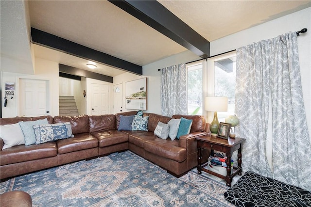 living room featuring beam ceiling