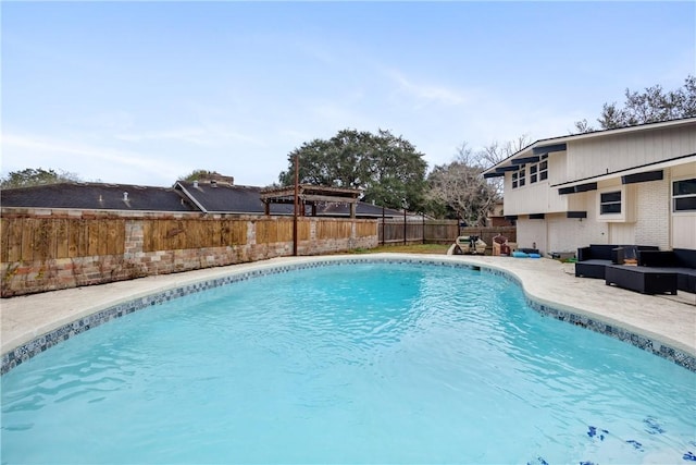 view of pool featuring outdoor lounge area and a patio area