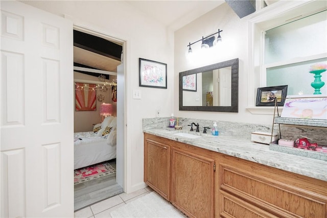 bathroom with tile patterned floors and vanity