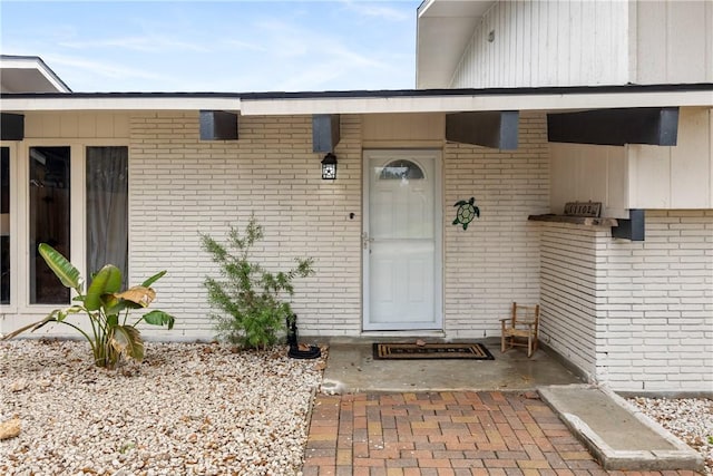 doorway to property with a patio area