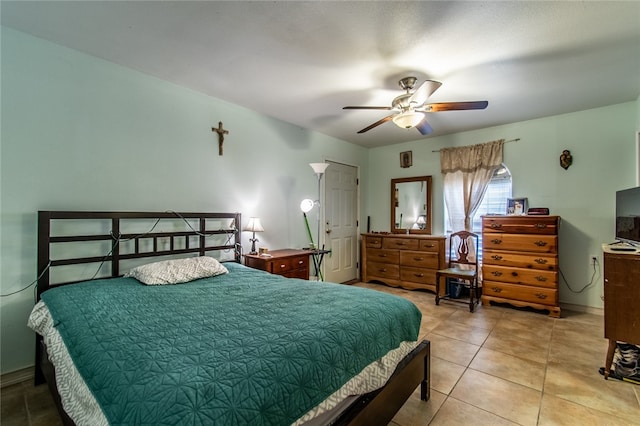 bedroom featuring light tile patterned floors and ceiling fan