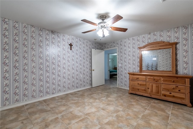 unfurnished bedroom featuring ceiling fan