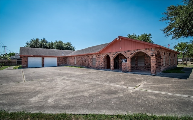 single story home with a garage