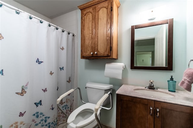 bathroom with toilet, vanity, and a shower with shower curtain