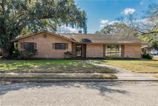 ranch-style house with a front lawn