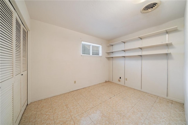 unfurnished bedroom featuring a closet