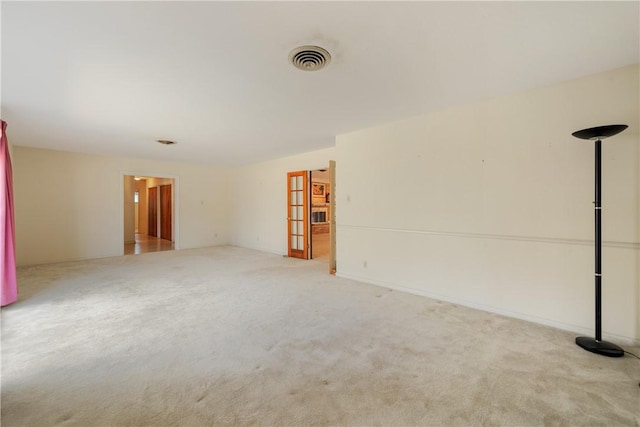 spare room with light colored carpet