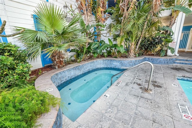 view of pool featuring a community hot tub