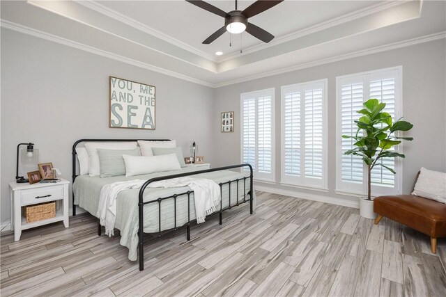 6401 Kobe Dr, Corpus Christi, TX 78414 - bedroom featuring a raised ceiling, light wood-type flooring, and ornamental molding