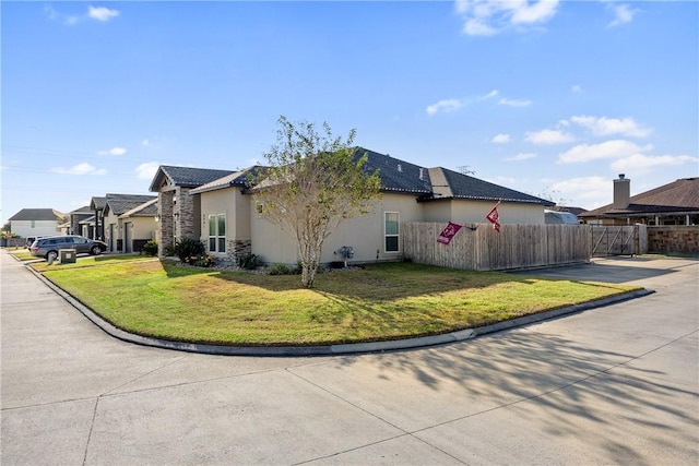 6401 Kobe Dr, Corpus Christi, TX 78414 - view of home's exterior featuring stucco siding, a tiled roof, and a residential view