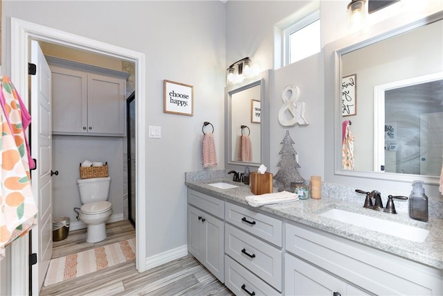 6401 Kobe Dr, Corpus Christi, TX 78414 - full bathroom featuring double vanity and wood finished floors