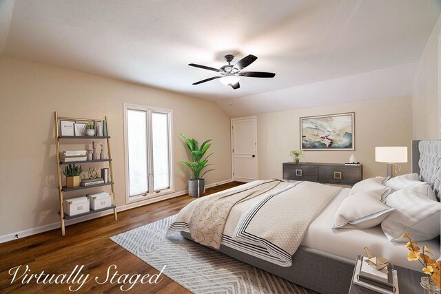 bedroom with ceiling fan, dark hardwood / wood-style floors, and lofted ceiling