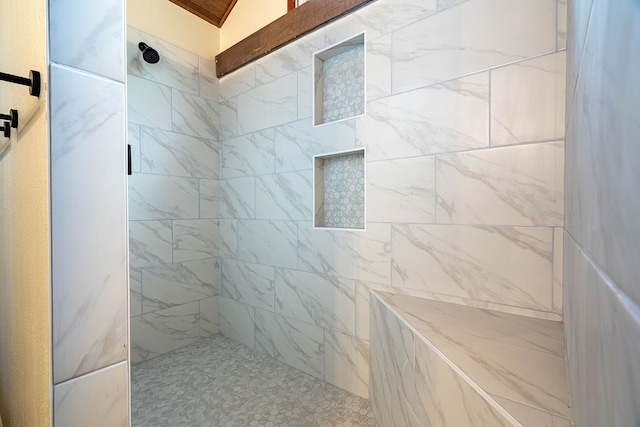 bathroom featuring tiled shower