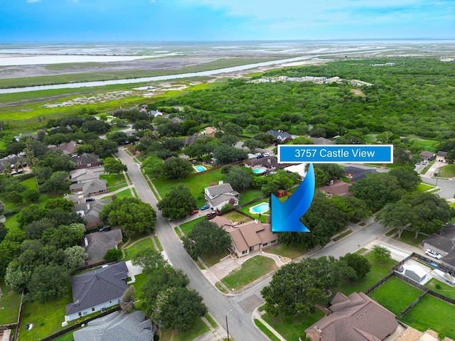 drone / aerial view with a water view and a beach view