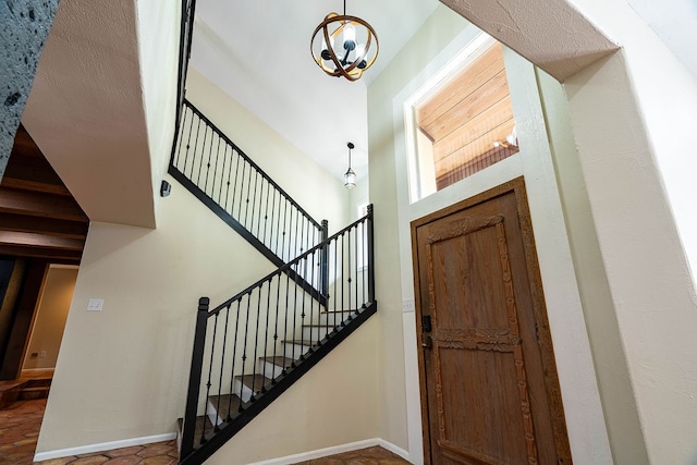 foyer entrance featuring a chandelier