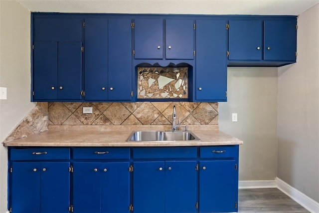4513 Green Grove Dr, Corpus Christi, TX 78415 - kitchen featuring light countertops, dark wood finished floors, and tasteful backsplash