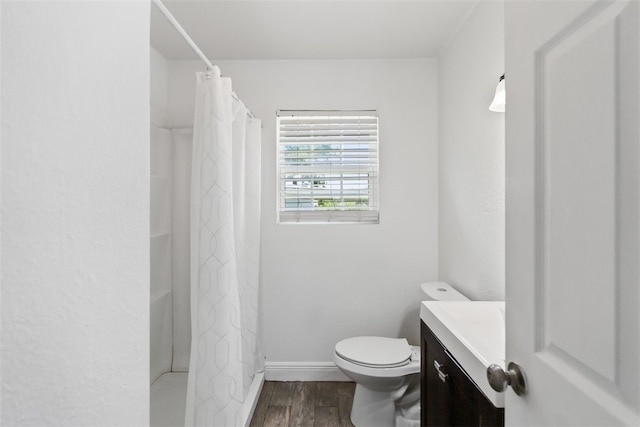 4513 Green Grove Dr, Corpus Christi, TX 78415 - bathroom featuring vanity, wood finished floors, and a shower with shower curtain
