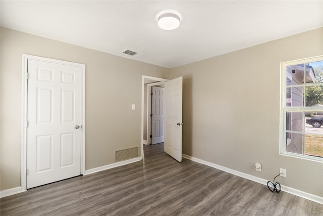 4513 Green Grove Dr, Corpus Christi, TX 78415 - unfurnished bedroom featuring wood finished floors and baseboards