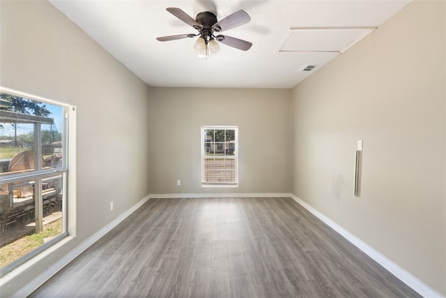 4513 Green Grove Dr, Corpus Christi, TX 78415 - spare room with healthy amount of natural light, wood finished floors, and ceiling fan