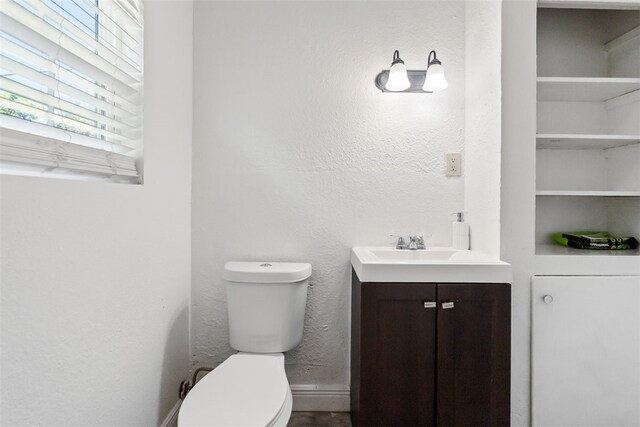 4513 Green Grove Dr, Corpus Christi, TX 78415 - half bathroom featuring vanity and a textured wall