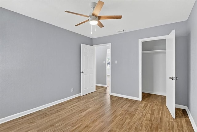 741 Lansdown Dr, Corpus Christi, TX 78412 - unfurnished bedroom with wood finished floors, a closet, and a ceiling fan