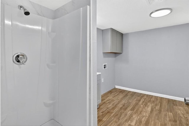 741 Lansdown Dr, Corpus Christi, TX 78412 - full bathroom with a shower and wood finished floors