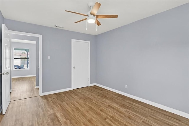 741 Lansdown Dr, Corpus Christi, TX 78412 - unfurnished bedroom with wood finished floors, ceiling fan, and a closet