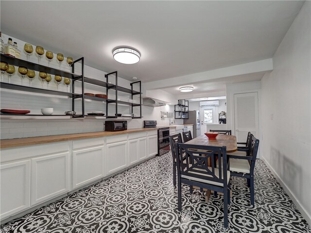 dining room with an AC wall unit