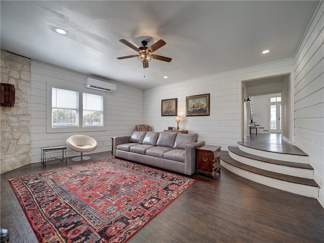 living room with dark hardwood / wood-style flooring, ceiling fan, a wealth of natural light, and a wall mounted AC