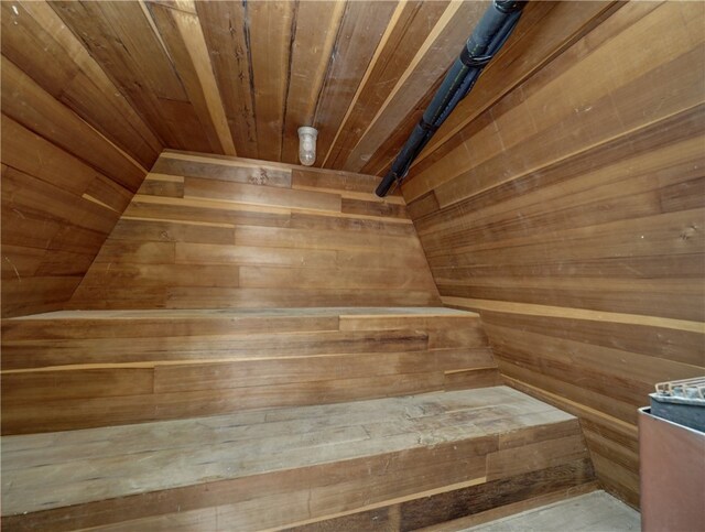 view of sauna / steam room with wood walls and wooden ceiling