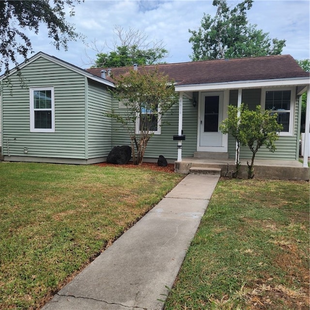 view of front of house with a front lawn and a porch