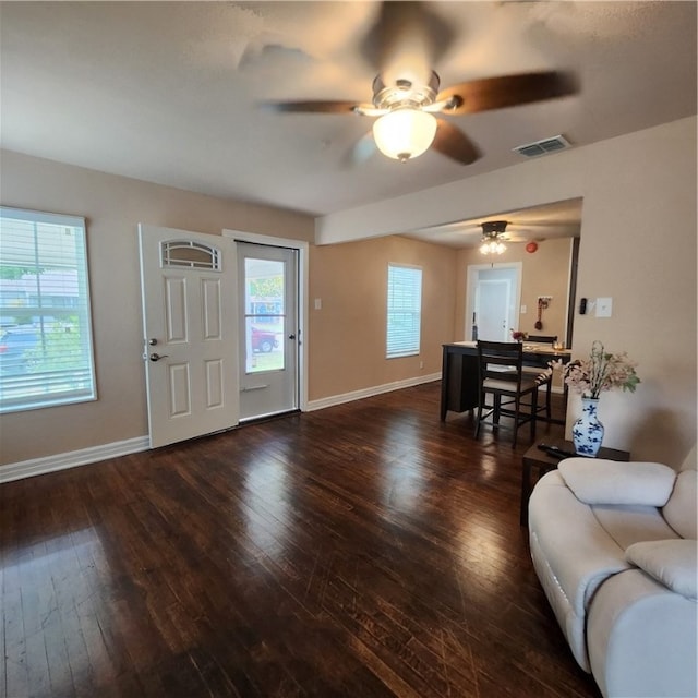 foyer with dark wood-type flooring and ceiling fan