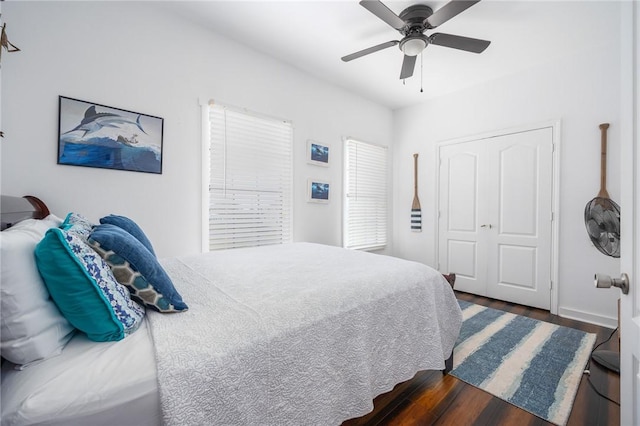 bedroom featuring dark wood-style floors and ceiling fan