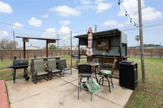 view of patio / terrace featuring outdoor dining space, area for grilling, and a fenced backyard