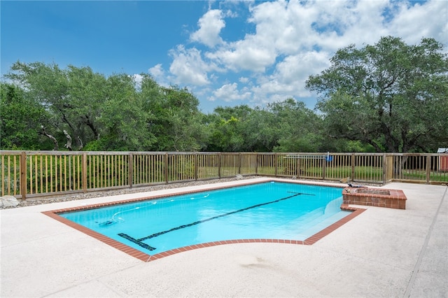 view of swimming pool with a patio