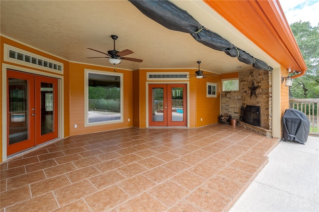 view of patio / terrace featuring french doors and ceiling fan