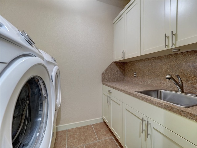 washroom with cabinets, sink, and light tile patterned floors