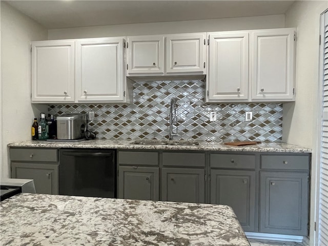 kitchen with backsplash, gray cabinets, sink, white cabinets, and dishwasher