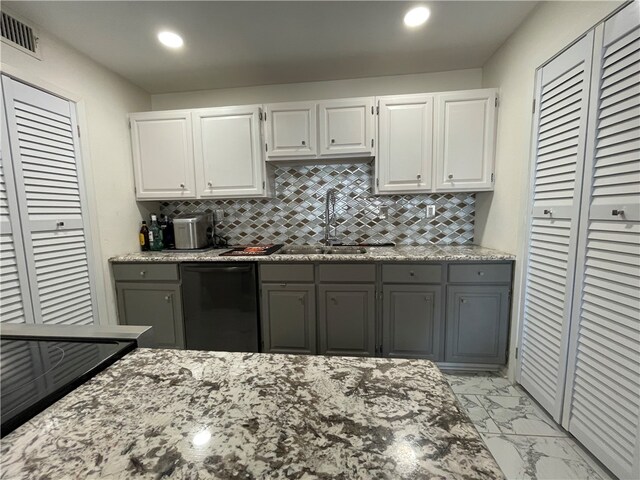 kitchen with white cabinetry, sink, tasteful backsplash, gray cabinets, and dishwasher