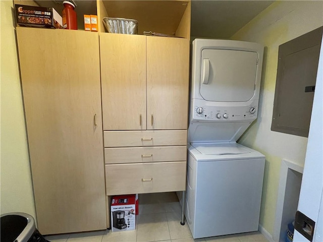 520 S Chaparral St Unit 402, Corpus Christi, TX 78401 - laundry area with electric panel, estacked washer and dryer, and light tile patterned flooring