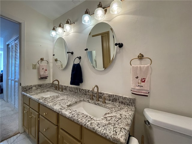 bathroom with vanity and toilet