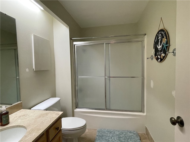 full bathroom with toilet, combined bath / shower with glass door, vanity, and tile patterned flooring