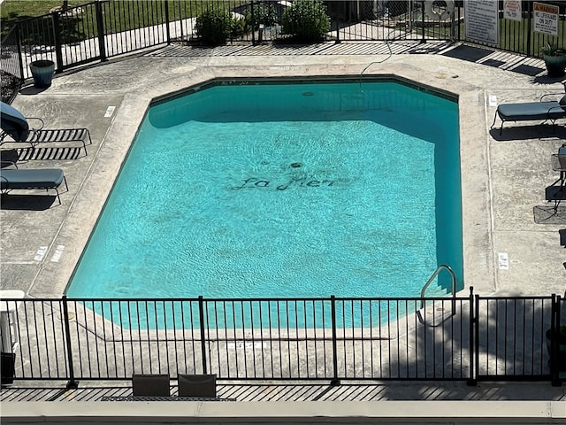 view of pool with a beach view and a water view